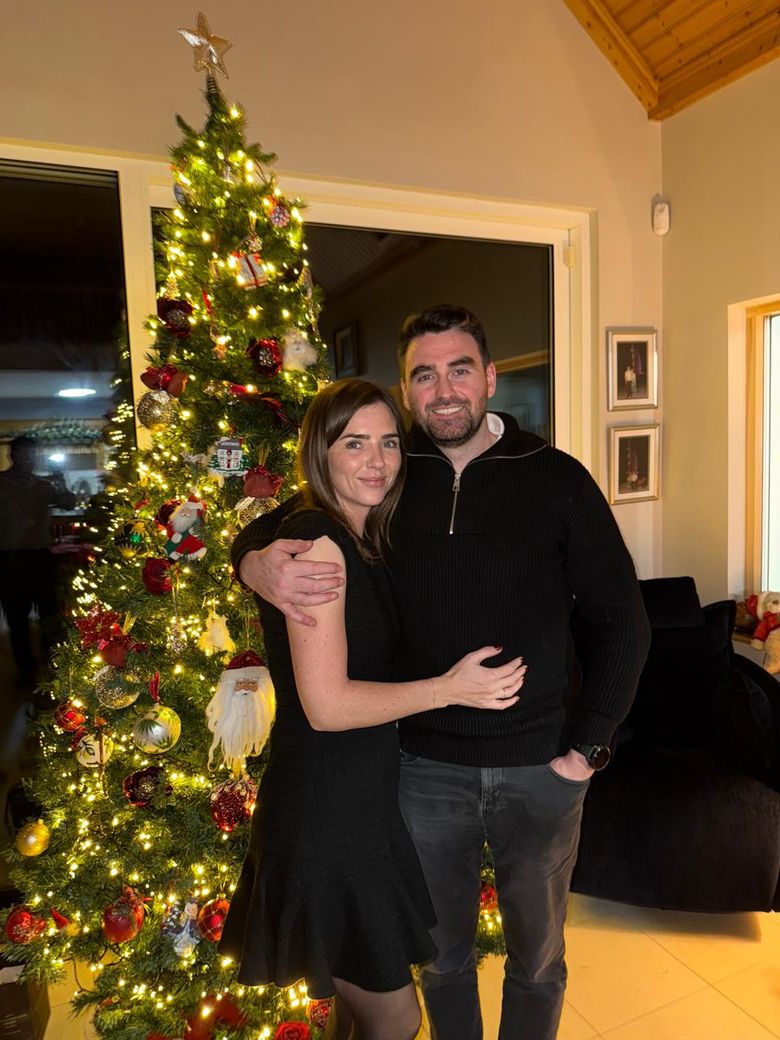 Niamh and Jack in front of a Christmas tree