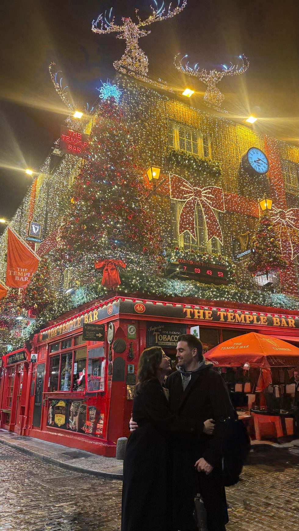 Niamh and Jack outside The Temple Bar at Christmas